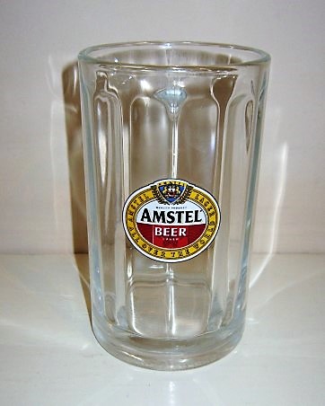 beer glass from the Amstel brewery in Netherlands with the inscription 'Amstel Beer Lager, Amstel Larger All Over The World'