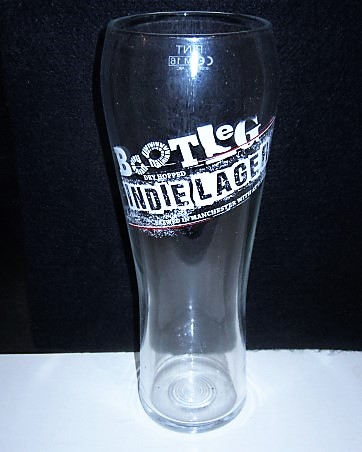beer glass from the Bootleg  brewery in England with the inscription 'Bootleg Dry Hopped Indie Lager, Brewed In Manchester With Attitude'