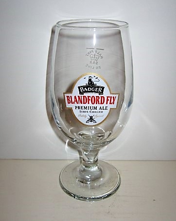beer glass from the Hall & Woodhouse brewery in England with the inscription 'Bader Blandford Fly Premium Ale Serve Chilled'
