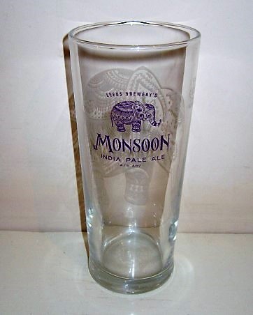 beer glass from the Leeds brewery in England with the inscription 'Monsoon India Pale Ale, Leed Brewery 4.1% Abv'