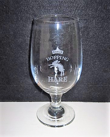 beer glass from the Hall & Woodhouse brewery in England with the inscription 'Badger Hopping Hare'
