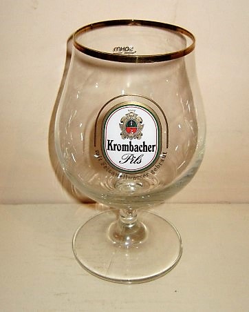 beer glass from the Krombacher brewery in Germany with the inscription 'Krombacher Pils Mit Felsquellwasser Gebraut'