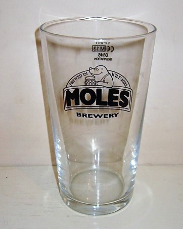 beer glass from the Moles brewery in England with the inscription 'Moles Brewery, Brewed In Wiltshire'