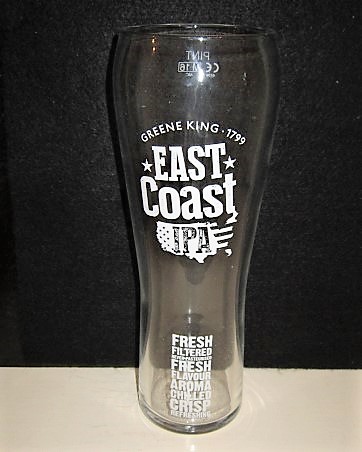 beer glass from the Greene King brewery in England with the inscription 'Greene King East Coast IPA, Fresh Filtered Never Pasteurised Fresh Flavour Aroma Chilled Crisp Refreshing'