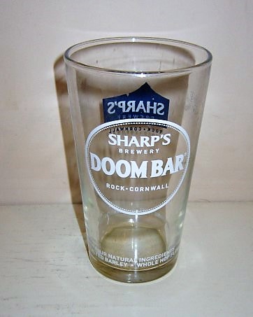beer glass from the Sharp's brewery in England with the inscription 'Sharp's Brewery, Doombar Rock Cornwall. Only Four Natural Ingredients, English Malt Barley, Whole Hop Flowers, Sharp's Unique Yeasy, Cornish Water'