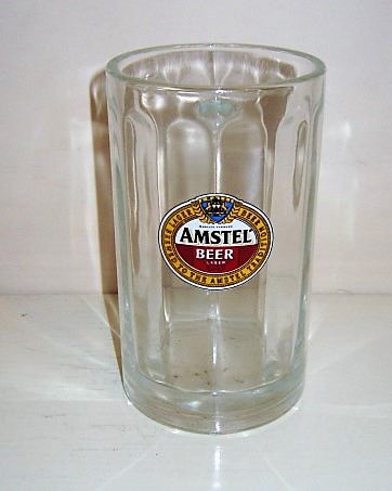 beer glass from the Amstel brewery in Netherlands with the inscription 'Amstel Beer, Lager Beer  Brewed To The Amstel Tradition'