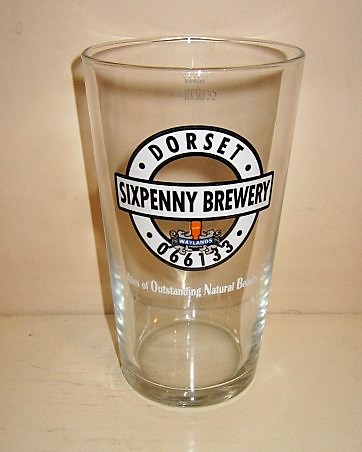 beer glass from the Sixpenny brewery in England with the inscription 'Dorset Sixpenny Brewery Waylands 066133 Alea Of Outstanding Natural Beauty'