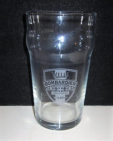 beer glass from the Charles Wells brewery in England with the inscription 'Wells Bombardier, English Premium Bitter ALC 5.2%'