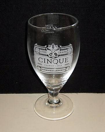 beer glass from the Shepherd Neame brewery in England with the inscription 'Five Grain Cinque Premium Lager, Barley.Rye.Wheat. Maize.Rice.'
