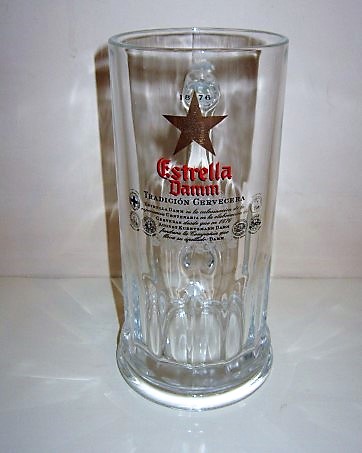 beer glass from the Damm brewery in Spain with the inscription '1876 Estrella Damm Tradigion Cervecera'