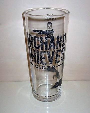 beer glass from the Heineken  brewery in Ireland with the inscription 'Orchard Thieves, Cider Stolen From Herfordshire'