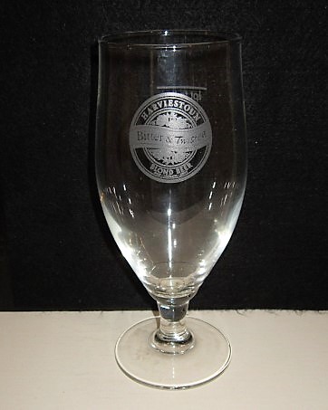 beer glass from the Harviestoun  brewery in Scotland with the inscription 'Harvieston Bitter & Twisted Blond Beer'