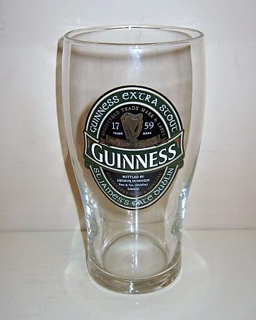 beer glass from the Guinness  brewery in Ireland with the inscription 'Guinness, Guinness Extra Stout St James's Gate DublinRegistered Trade Mark & Lable 1759 Dublin Ireland Bottled By Arther Guinness Son & Co Dublin Ltd Guaranteed Pure & Genuine  '