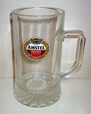 beer glass from the Amstel brewery in Netherlands with the inscription 'Cerveza Amstel Aguila 100% Malta Premium Quality Elaborada Segun La Tradicion De Amstel'