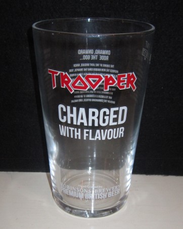 beer glass from the Robinsons brewery in England with the inscription 'Trooper Charged with flavour hand crafted by Robinsons Brewery Premium British Beer'