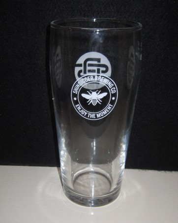 beer glass from the Shindigger brewery in England with the inscription 'Shindigger Brewing Co Enjoy The Moment'