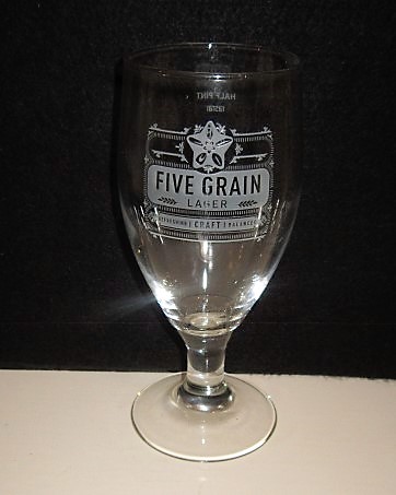 beer glass from the Shepherd Neame brewery in England with the inscription 'Five Grain Lager, Refreshing Craft Balanced'