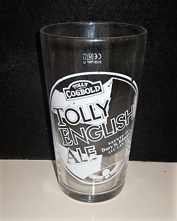beer glass from the Greene King brewery in England with the inscription 'Tolly Cobbold, Tolly English Ale Brewed In Bury St Edmunds Alc 2.8% Vol'