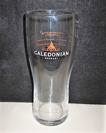 beer glass from the Caledonian  brewery in Scotland with the inscription 'Caledonian Brewery, Brewed By Hand In Ebinburgh @Ebinburghbeer'