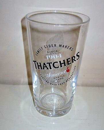 beer glass from the Thatchers brewery in England with the inscription 'Thatchers Somerset Myrtle Farm, Family Cider Makers Since 1904 Crafted Over Four Generations'