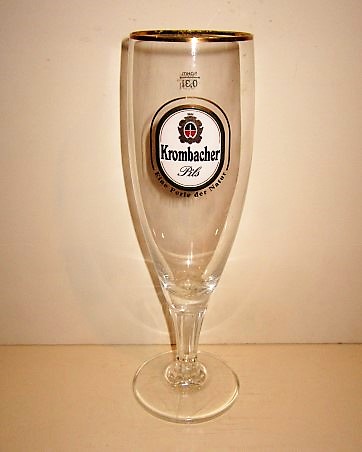 beer glass from the Krombacher brewery in Germany with the inscription 'Krombacher Pils, Eine Perle Der Nature'