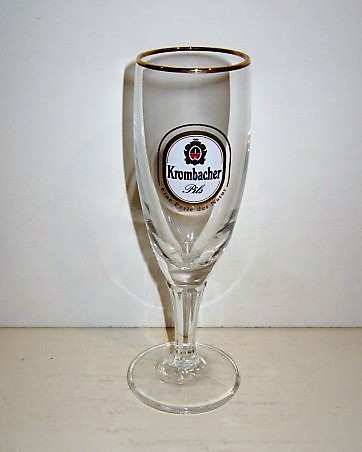 beer glass from the Krombacher brewery in Germany with the inscription 'Krombacher Pils, Eine Perle Der Nature'
