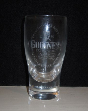 beer glass from the Guinness  brewery in Ireland with the inscription 'Guinness Extra Stout Traditionally Brewed St James's Gate Dublin'