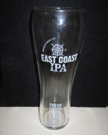 beer glass from the Greene King brewery in England with the inscription 'East Coast IPA Crafted By Greene King, Fresh Filtered Never Pasteurised Fresh Flavour Aroma Chilled Crisp Refreshing'