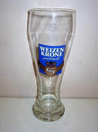 beer glass from the Dinkelacker-Schwabenbraeu brewery in Germany with the inscription 'Weizen Krone Perl Stark Sanwald Sanwald Braut Besondere Biere'