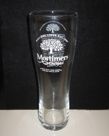 beer glass from the Westons Cider brewery in England with the inscription 'Mortimers Orchard, Westons Cider EST 1880 Made With 100% Fresh Apple Juice'
