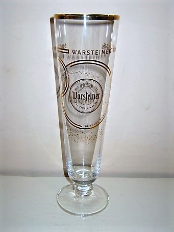 beer glass from the Warsteiner brewery in Germany with the inscription 'Warsteiner Tulip Glass, Seit 1733 Warsteiner Das Einzig Wahre. 50 Years Warsteiner Tulip Glass'