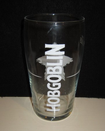 beer glass from the Wychwood  brewery in England with the inscription 'Hobgoblin The Unofficial Beer Of Halloween'