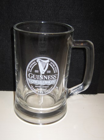 beer glass from the Guinness  brewery in Ireland with the inscription 'The Original Extra Stout Est 1759, Guinness Original Extra Stout Original Recipe Dark And Liveley'