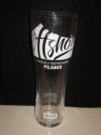 beer glass from the Sharp's brewery in England with the inscription 'Offshore Uniquely Refreshing Pilsner, Sharps's Brewery Established 1994'