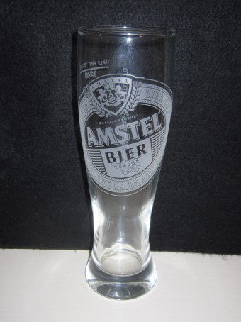beer glass from the Amstel brewery in Netherlands with the inscription 'Amstel Lager Bier Amstel Brouwerij B.V. Amsterdam Holland Quality Product Amstel Bier Lager'