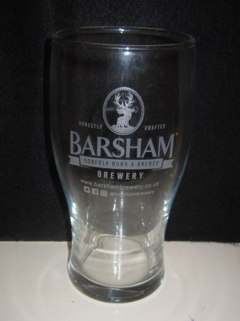 beer glass from the Barsham brewery in England with the inscription 'Barsham Brewery, Norfolk Born & Bread Honestly Crafted, www.barshambrewery.co.uk @bashambrewery'
