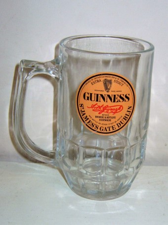 beer glass from the Guinness  brewery in Ireland with the inscription 'Guinness St James's Gate Dublin Extra Stout, Bottled By Brewers7Bottlers How Bottle No Other Stout Or Porter'