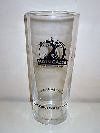 beer glass from the Norfolk Brewhouse brewery in England with the inscription 'Moon Grazer Norfolk Brewhouse Craft, moongrazerale.co.uk'