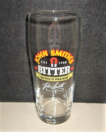 beer glass from the John Smith's brewery in England with the inscription 'John Smith's Est 1758 Bitter Brewed In Yorkshire John Smiths'