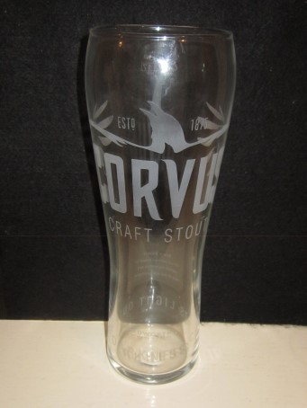 beer glass from the Wadworth brewery in England with the inscription 'ESTD 1875 Corvus Craft Stout, Wadworth Brewed In Wiltshire Since 1875'