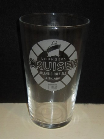 beer glass from the Bristol Beer Factory  brewery in England with the inscription 'Loungers Cruiser Atlantic Pale Ale 4.5% ABV Bristol Beer Factory'