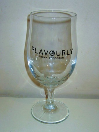 beer glass from the Bad Co brewery in England with the inscription 'Flavourly Drink Different'