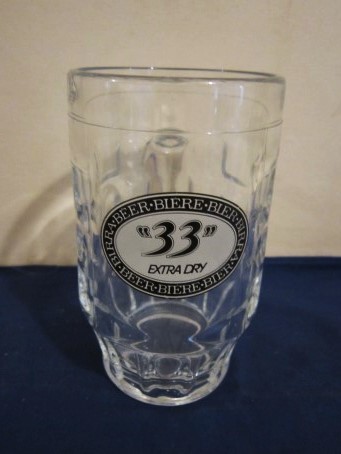 beer glass from the Pelican-Pelforth brewery in France with the inscription '33 Extra Dry, Beer,Biere,Bier,Birra - Beer,Biere,Bier,Birra'