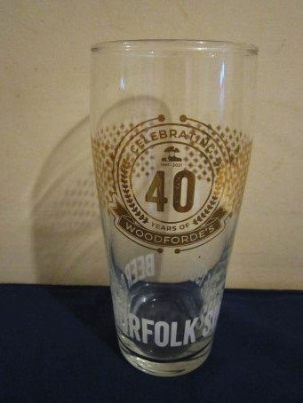 beer glass from the Jennings brewery in England with the inscription 'Celebrating 40 Years Of Woodforde's, Beer Of Norfolk Since 1981 '