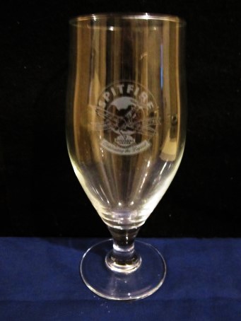 beer glass from the Shepherd Neame brewery in England with the inscription 'Spitfire Celebrating A Legend Shepherd Neame'
