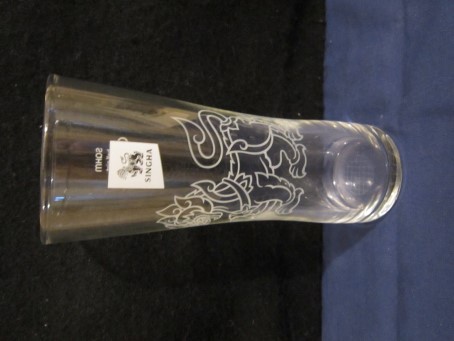 beer glass from the Singha brewery in Thailand with the inscription 'Singha'