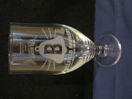 beer glass from the Bellfield  brewery in Scotland with the inscription 'B Bellfield Brewery, Craft Beer For All Gluten Free'