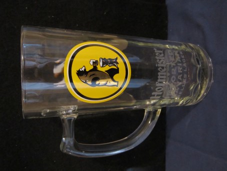 beer glass from the Schweiger brewery in Germany with the inscription 'Hofmeister Imported Bavarian Helles Lager, Pure Mineral Water Locally Sourced Hops & Barley.'