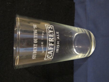 beer glass from the Caffrey's brewery in Northern Ireland with the inscription 'Caffrey's Irish Ale, Since 1897 Student Outing (98)'