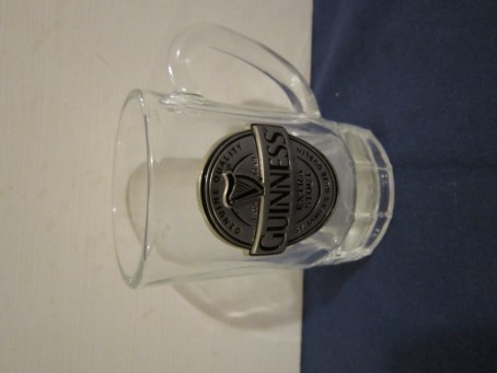 beer glass from the Guinness  brewery in Ireland with the inscription 'Guinness Extra Stout Genuine Quality ESTD 1759 St James's Gate Dublin'